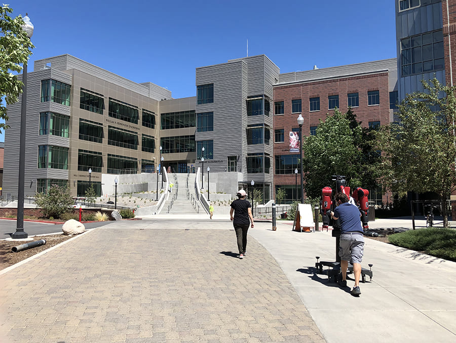 two people move robot into William N. Pennington Engineering Building